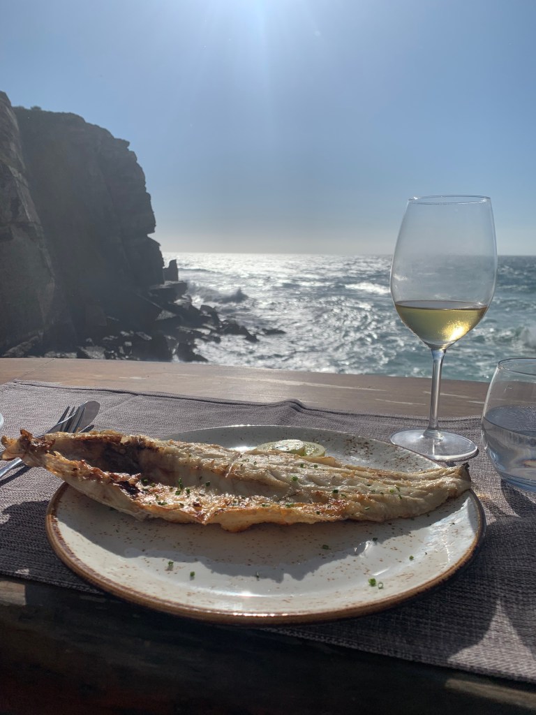 A photo of a sea bream meal overlooking the Atlantic Ocean at Azenhas do Mar Restaurant